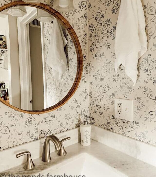 New-faucets-countertops-Faux-wallpaper-and-new-mirror-in-Small-Bathroom-Remodel-