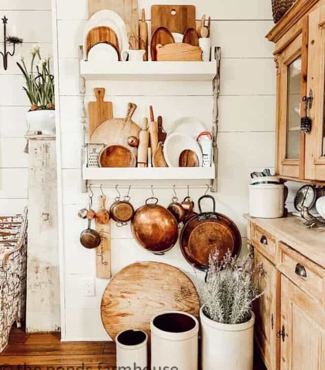 cropped-Plate-Rack-with-copper-bread-boards-and-old-crocks-filled-with-lavendar.jpg