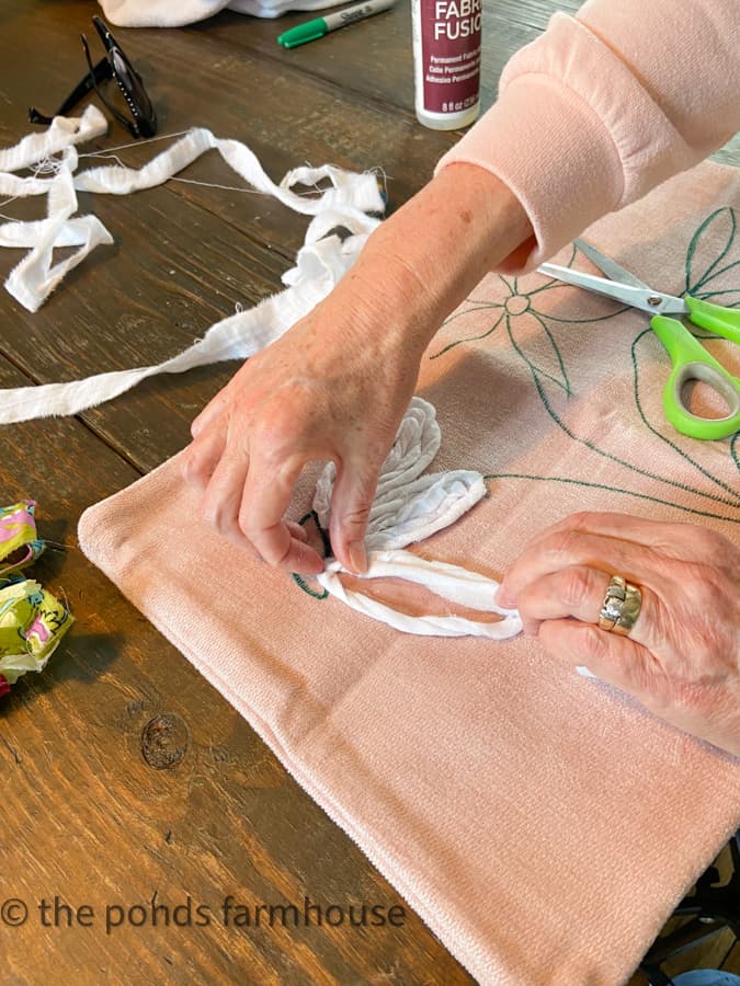 Use scrap white fabric to make petals on flowers for recycling ideas using fabric textiles in up-cycle project.