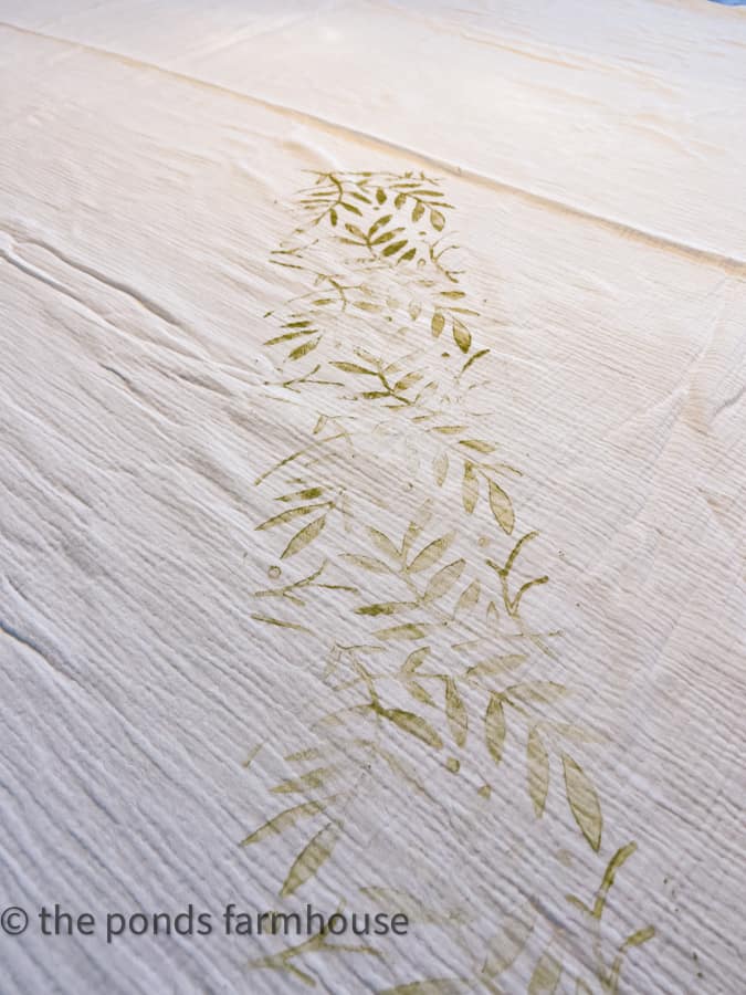 Roll the leaf paint roller randomly onto the 100% cotton fabric to make a custom tablecloth for Spring decorating.