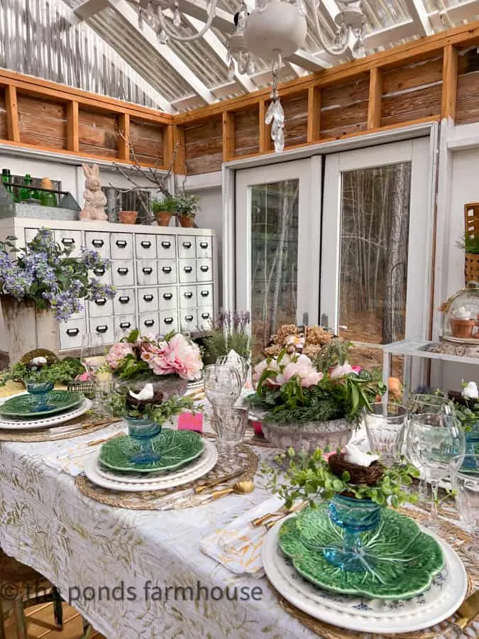 What is A Spring Fling in She Shed with DIY Apothecary Cabinet with Peonies in concrete urns and vintage blue dessert glasses .