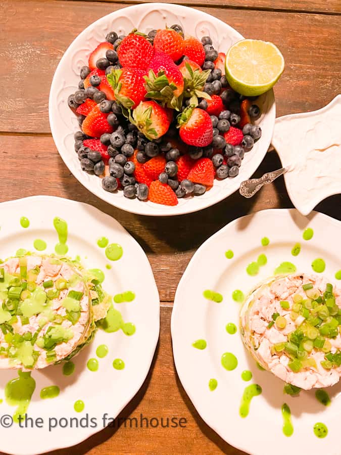 Two Cobb Salads with Chicken Stacks served with fresh Strawberries and Blue Berries