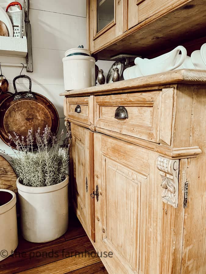 Antique Furniture - Honey Pine Hutch with decorative trim work and old crocks.