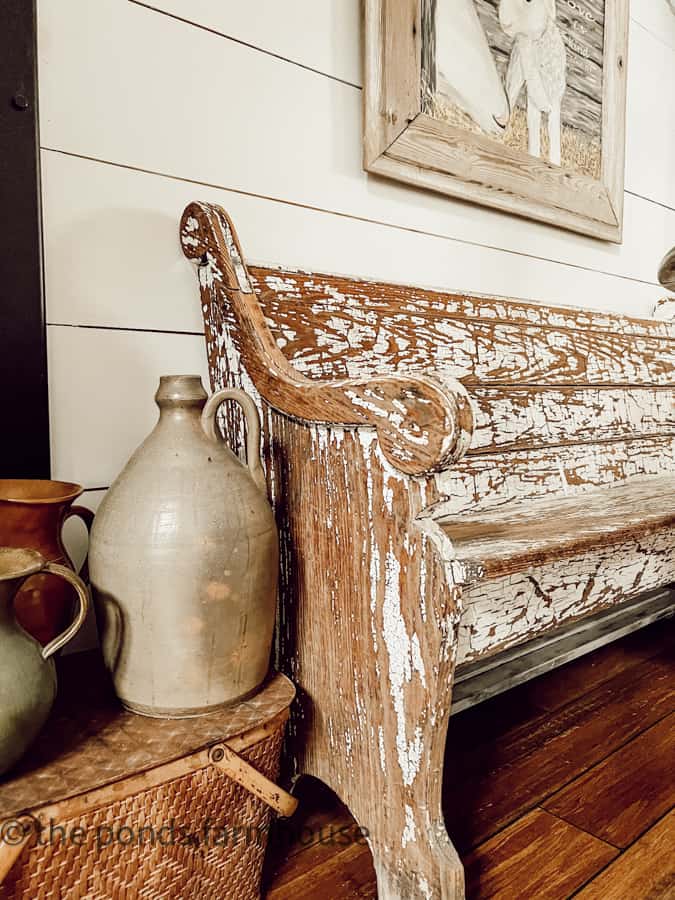 Antique Furniture  - Decorating with antiques like a chippy church pew and old stoneware jug. 