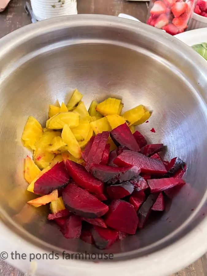 Golden beets and red beets peeled and slicd.