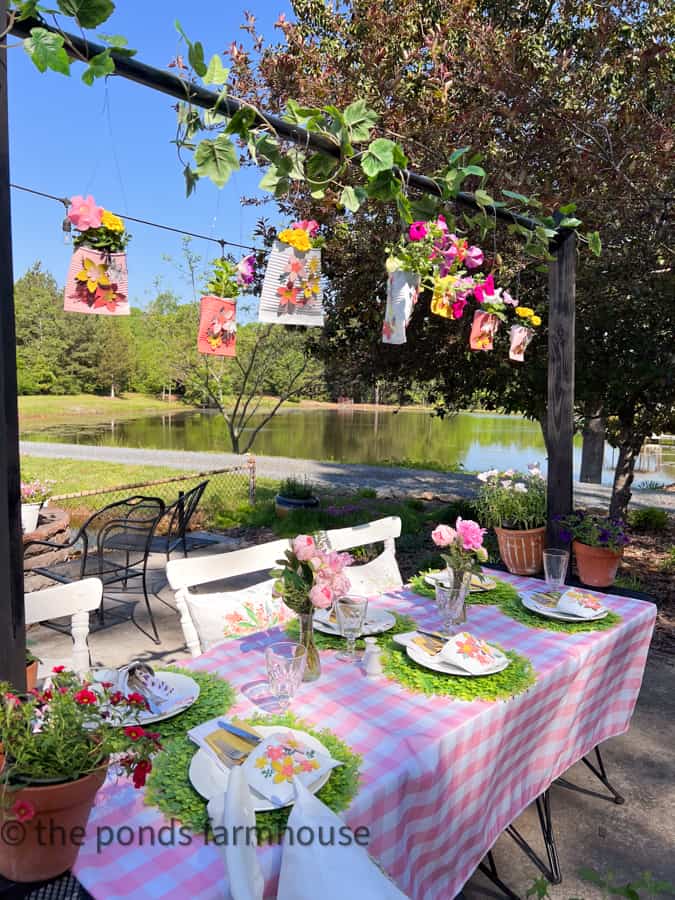 Add fresh flowers to DIY plant pot pockets that hang above the luncheon table for Mother's Day Luncheon Ideas.