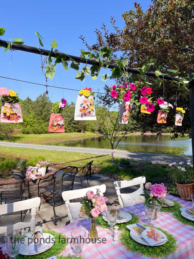 Hang the flower pockets from The DIY Over the table Rod Stand to decorate for Mother's Day and add fresh flowers to the pockets.