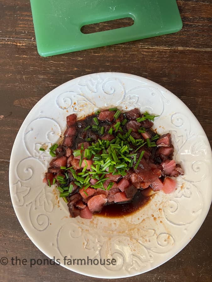 Poke Tuna marinate with soy sauce, chives, toasted sesame oil and nuts.