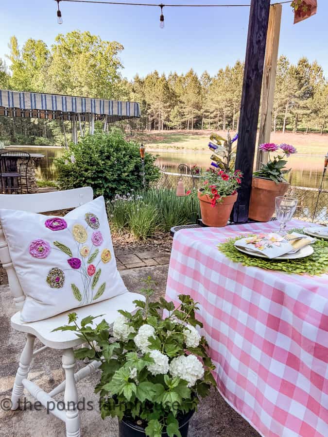 DIY scrap fabric pillow cover with plants that will be transplanted into the yard after the luncheon.