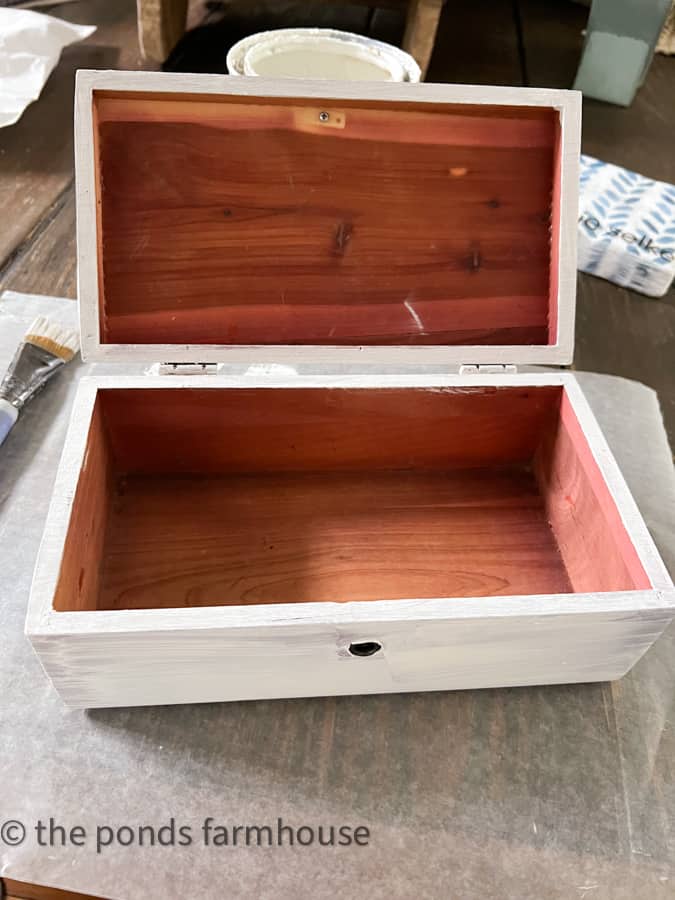 Paint the outside of the wooden box and leave the natural cedar inside untouched.