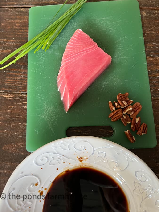 Sushi Grade Yellow Fin Tuna, nuts and chives