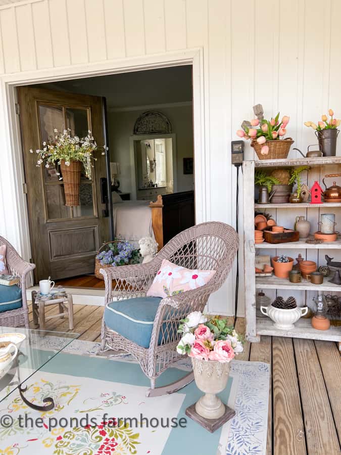 Spring Front Porch Decorating Ideas with DIY Rug and DIY pillows.  Faux flowers and baskets.