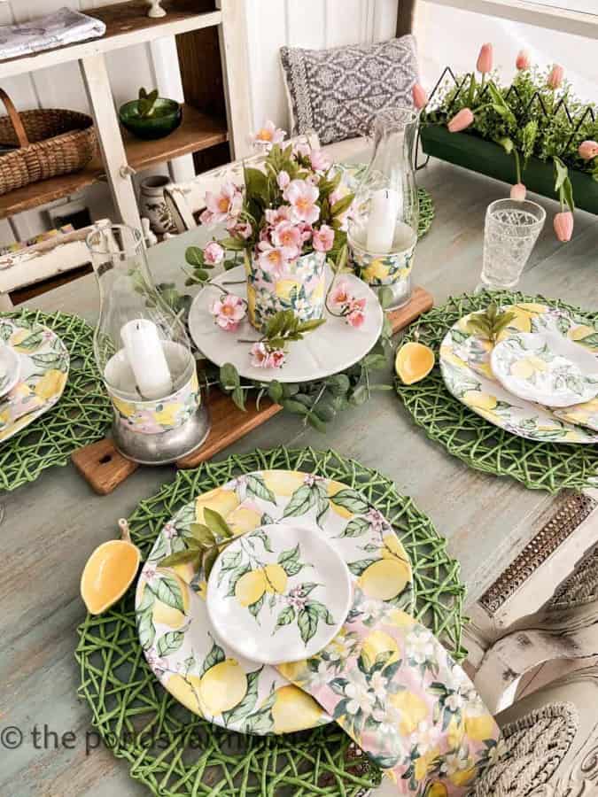 Lemon tableware with pink and green table accessories for recycled Tin Can Centerpiece.