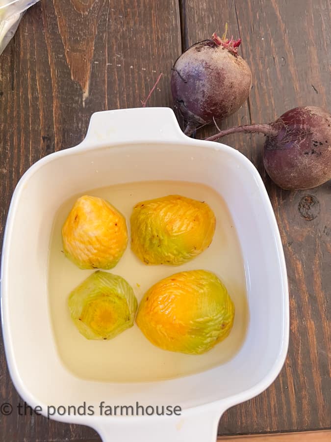 Cook beets in oven with small amount of water until done.