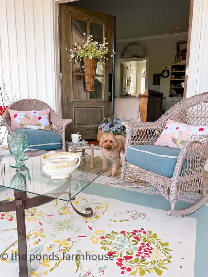 Front Porch Sitting ideas with DIY painted Rug and DIY recycled pillows.  Mini Golden Doodle.  