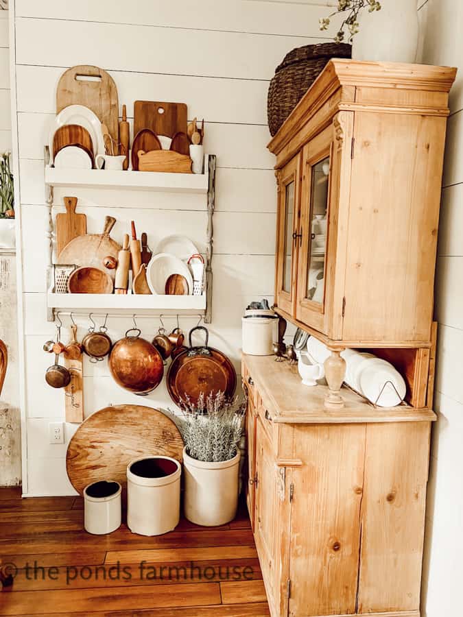 Antique Furniture - side view of Pine Hutch DIY plate rack with copper, ironstone, and breadboards 