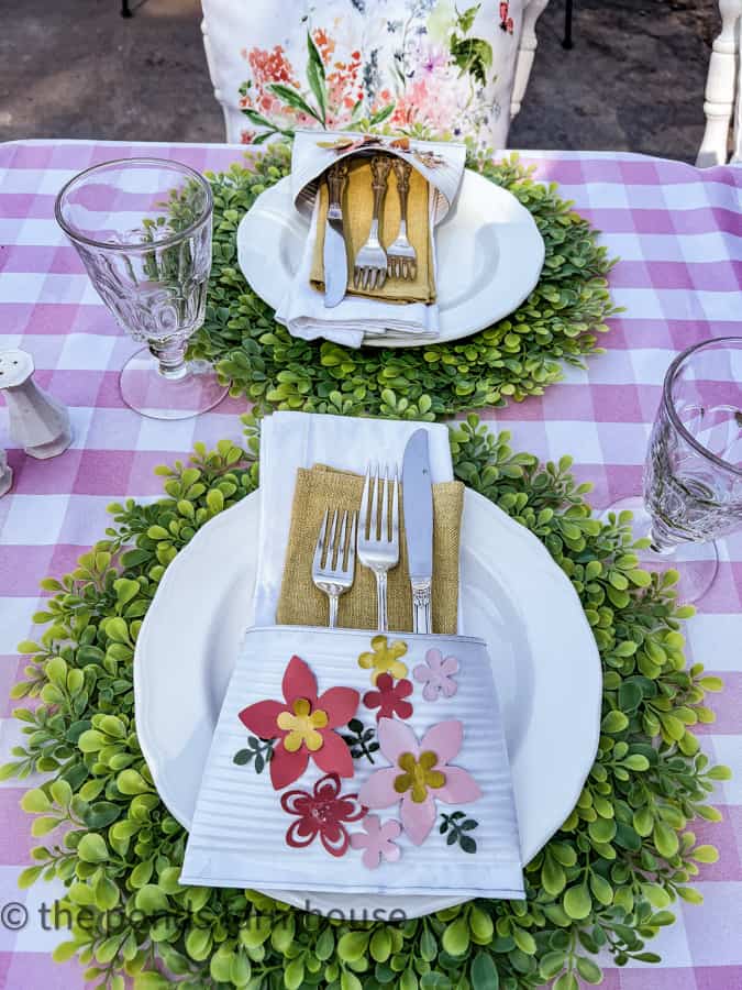 Place sittings with DIY recycled cutlery pockets made from tin cans and aluminum flowers for Mother's Day Luncheon Ideas