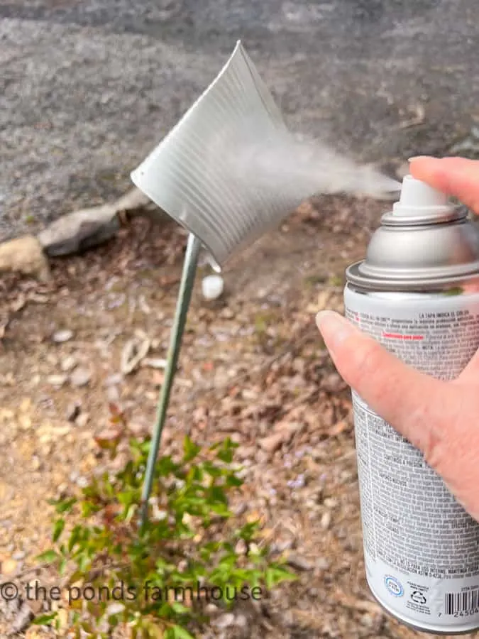 Spray paint up-cycled tin cans for DIY Recycling projects.