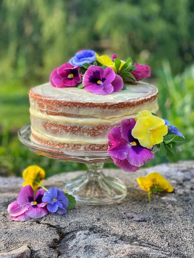 Semi-homemade naked cake with edible flowers for a Mother's Day Brunch Dessert Idea.