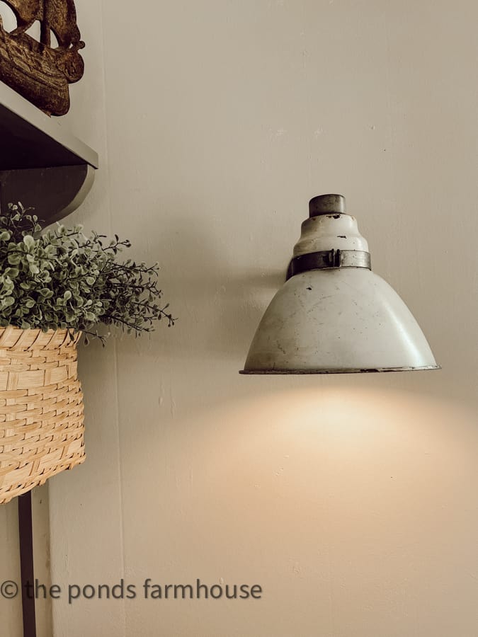 vintage light fixture added to beach cottage wall.  