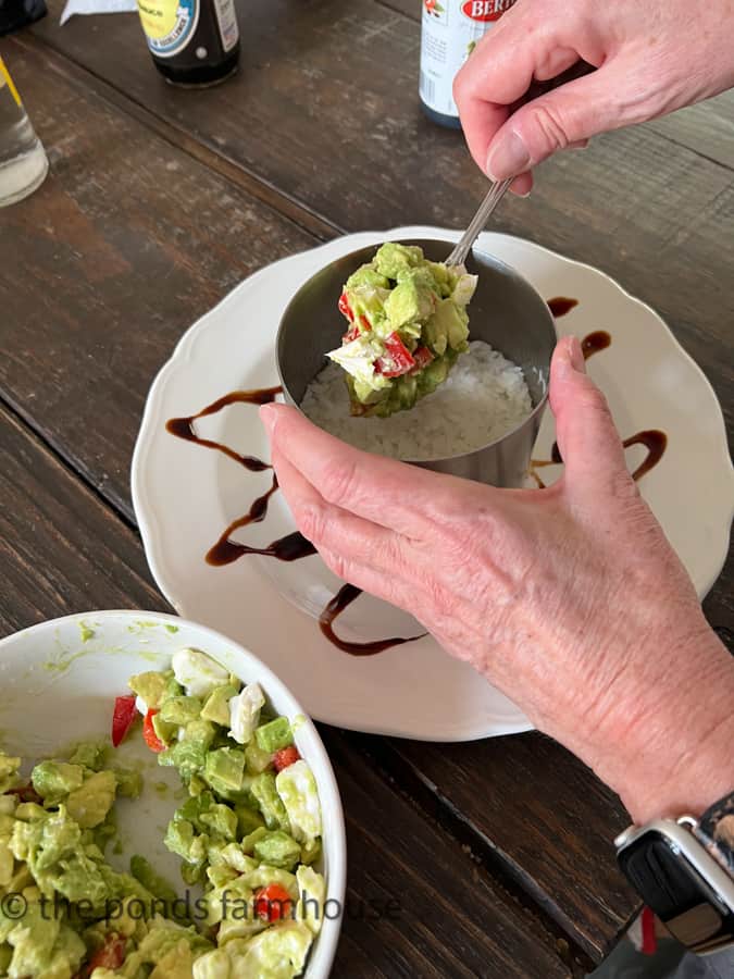 Avocado, creme cheese and red peppers is the second layer of the tuna stack.