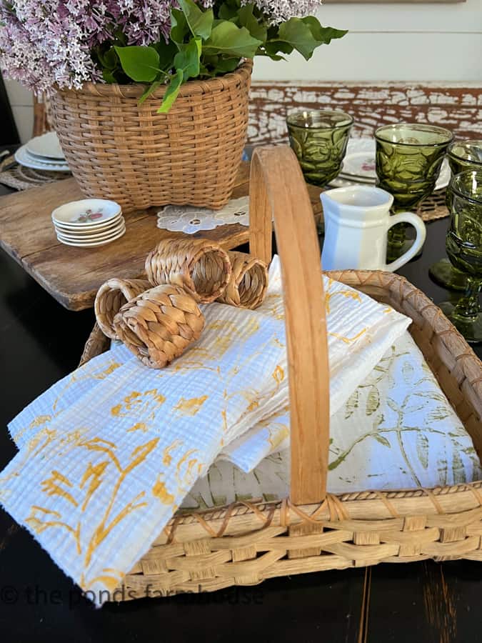 Basket Decor Ideas - using a flat bottom basket to hold table linen and table cloth.  