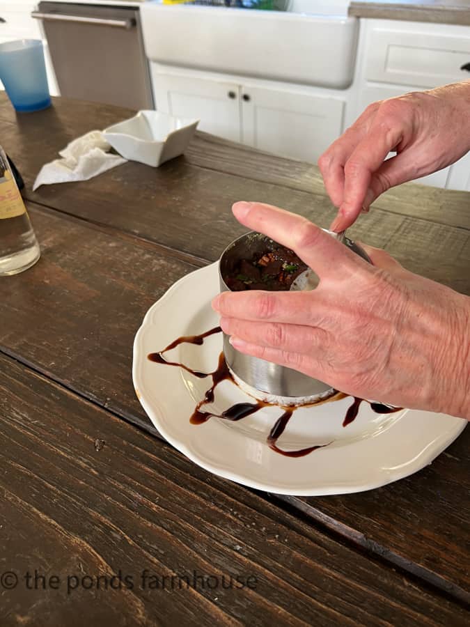 Lift the mold off the tuna poke stack.