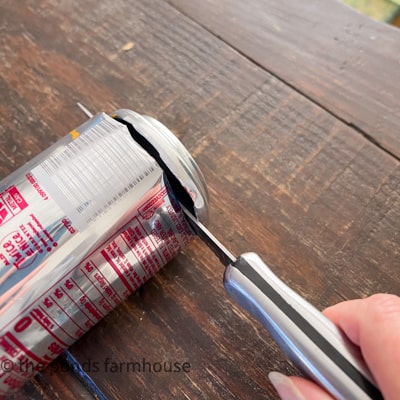 Cut top and bottom off aluminum cans to make flowers for DIY projects. 