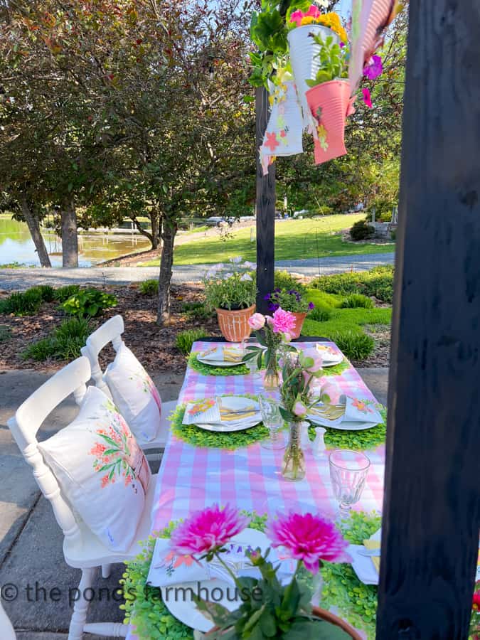 Add fresh flowers to DIY plant pot pockets that hang above the luncheon table for Mother's Day Luncheon Ideas.