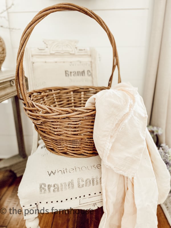 Basket and vintage linens from barn sale.