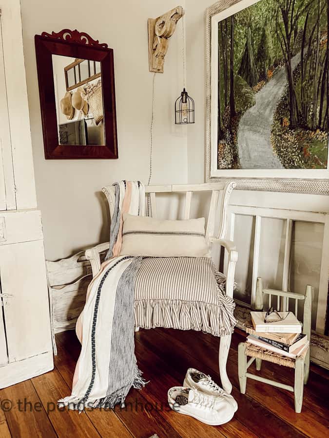 Bedroom Decor Ideas for adding vintage charm. Childs chair holds books and glasses in bedroom reading corner.  