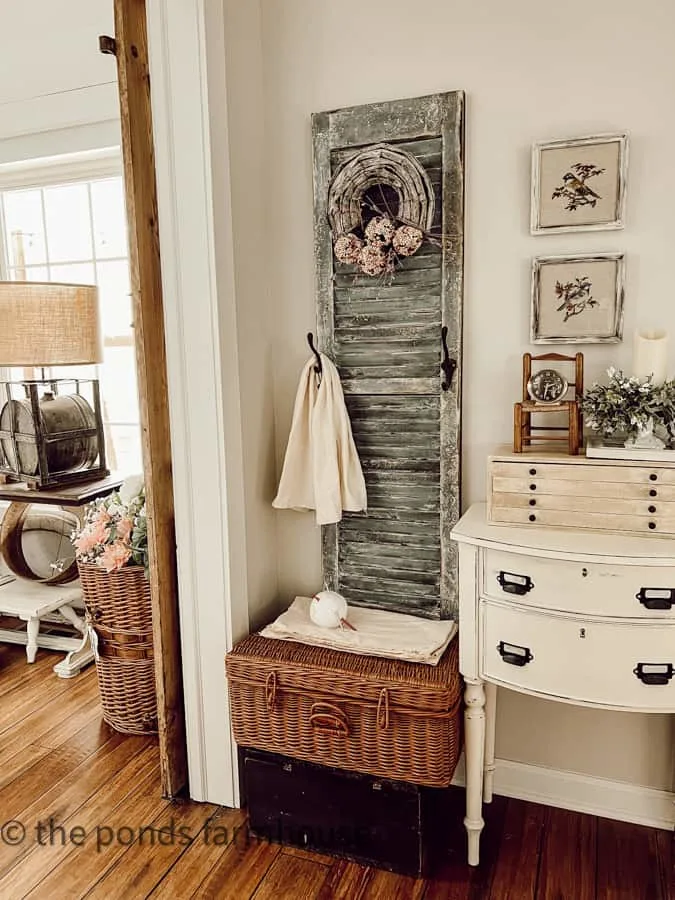 Add vintage art to create vintage charm in bedroom decorating.
