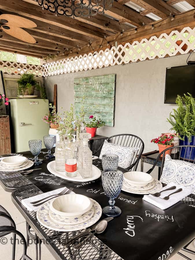 Place setting for Old Fashioned Father's Day Dinner Ideas in outdoor kitchen with vintage refrigerator.