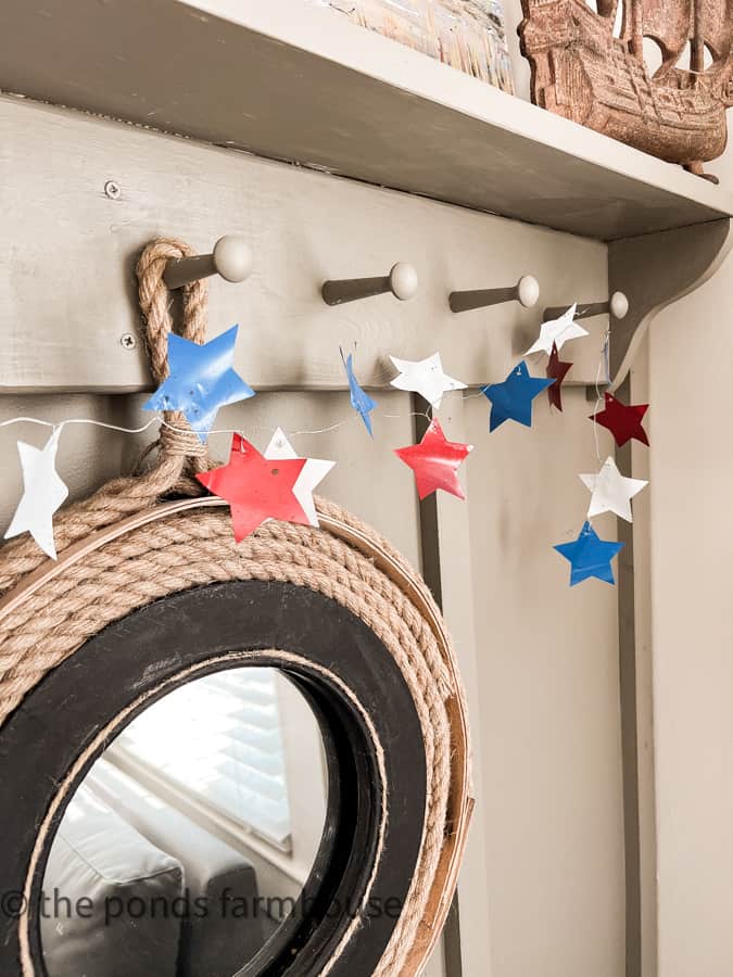 Aluminum can recycled star garland for 4th of July decorating on a budget with farmhouse style