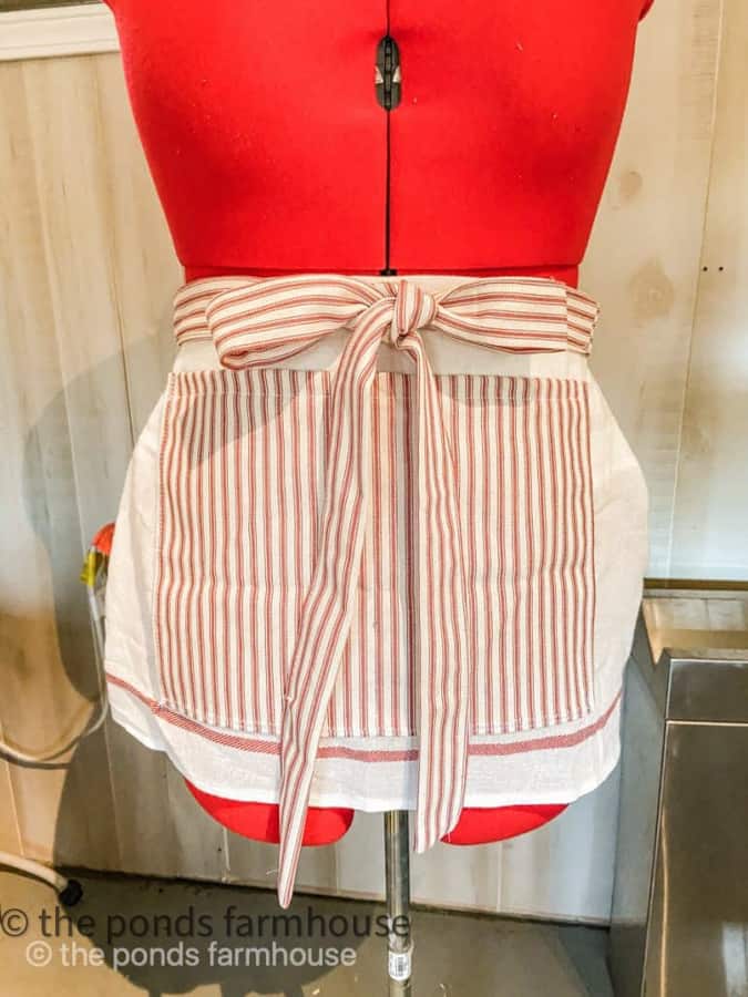 Unique craft and garden apron made from a tea towel and red and white ticking fabric.  