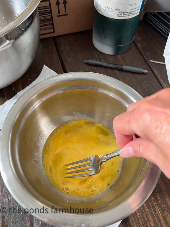 Beat eggs for bread pudding recipe.