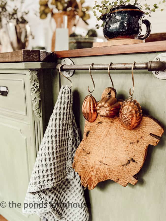 Copper molds and pig cutting board for decorating with vintage kitchen decor in a modern farmhouse.