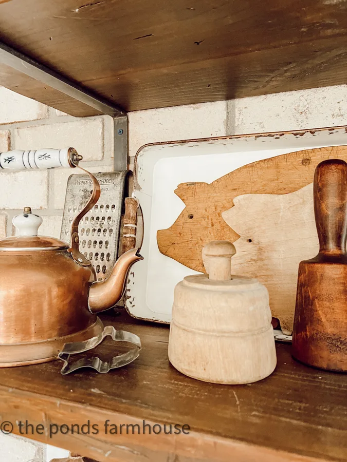Pig cutting boards, better mold & copper tea pot for vintage kitchen decor decorating ideas in farmhouse.
