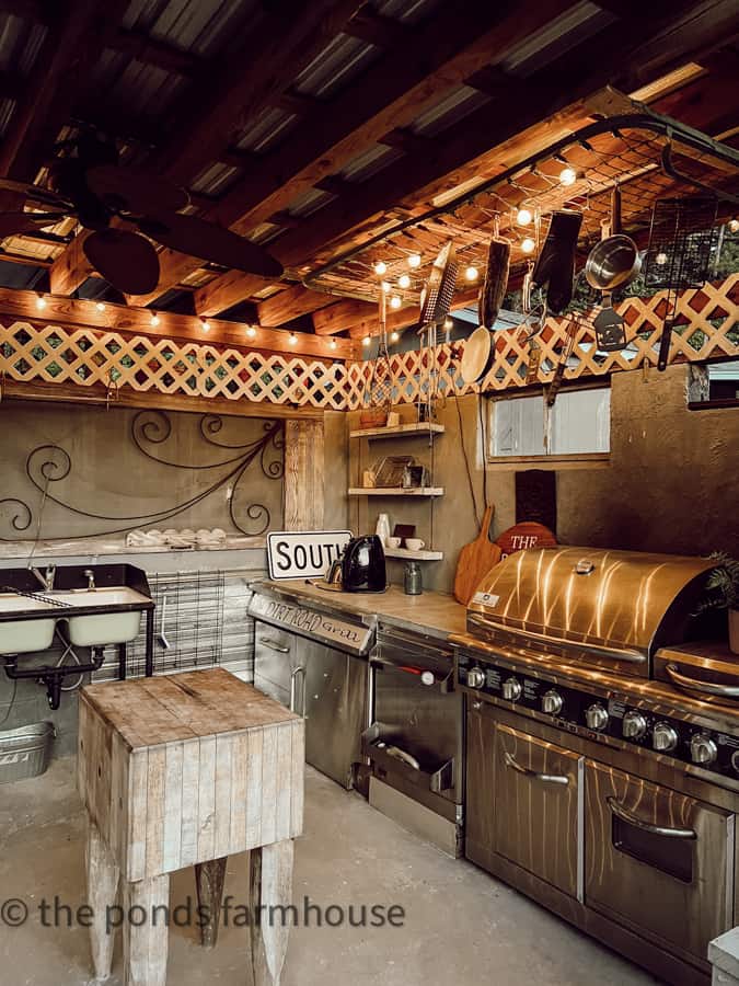 Outdoor kitchen with a UP-Cycled Metal Bed used for hold grilling utensils.  