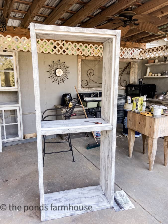 DIY Rustic kitchen cabinet with window stops installed.