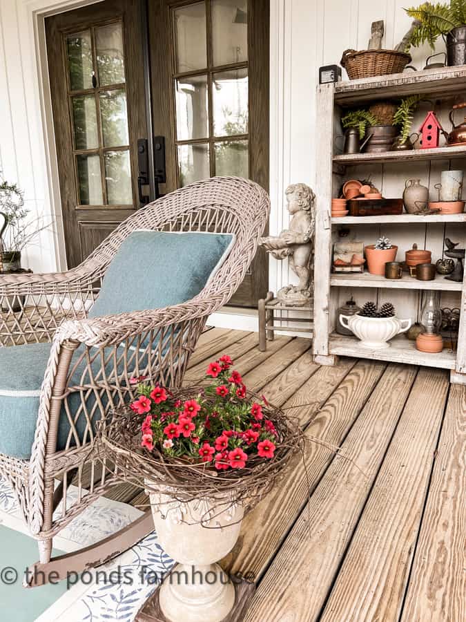 Plants and Wicker Chair with thrifted porch decor for country chic decorating. 