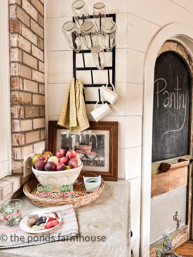 Budget Thrifted Decor Art on Kitchen Countertops with vintage bowl filled with fruit.