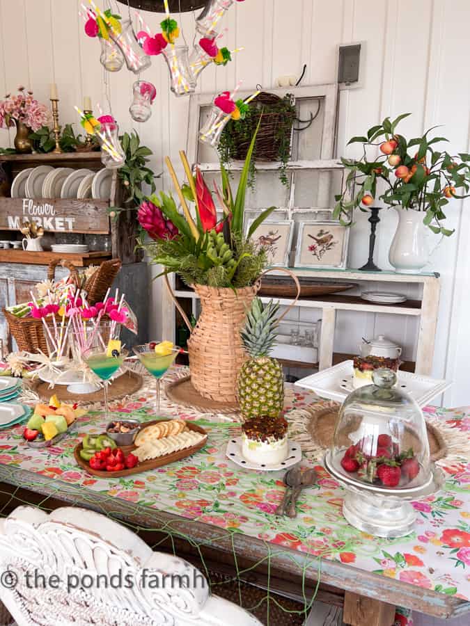 Hawaiian Party Ideas with pina colada martinis and charcuterie boards, fresh fruit skews and poke tuna stacks.