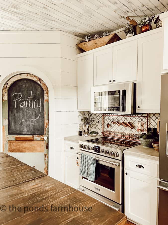 Kitchen Countertops with brass spice rack and DIY pantry Door.  