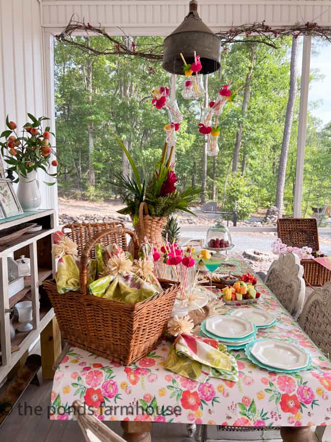 Hawaiian themed Party Ideas for a tropical cocktail party with DIY Straw Pom Pom napkin rings in a basket