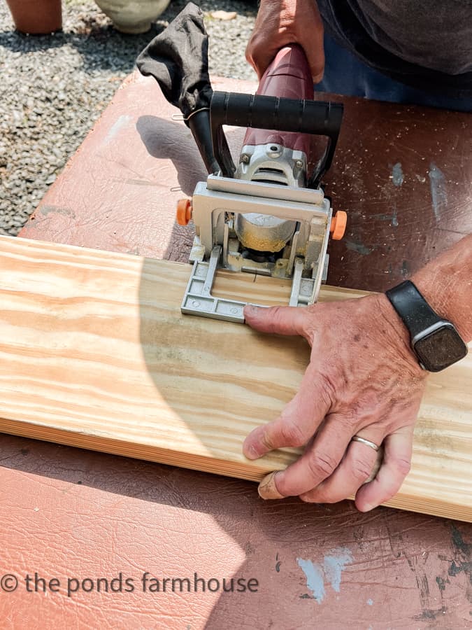 Joints marked for biscuit cutter for DIY rustic kitchen cabinet.