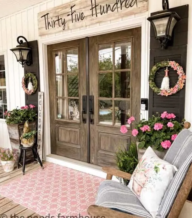 cropped-Country-Porch-French-front-doors-with-pink-rug-and-address-sign.jpg