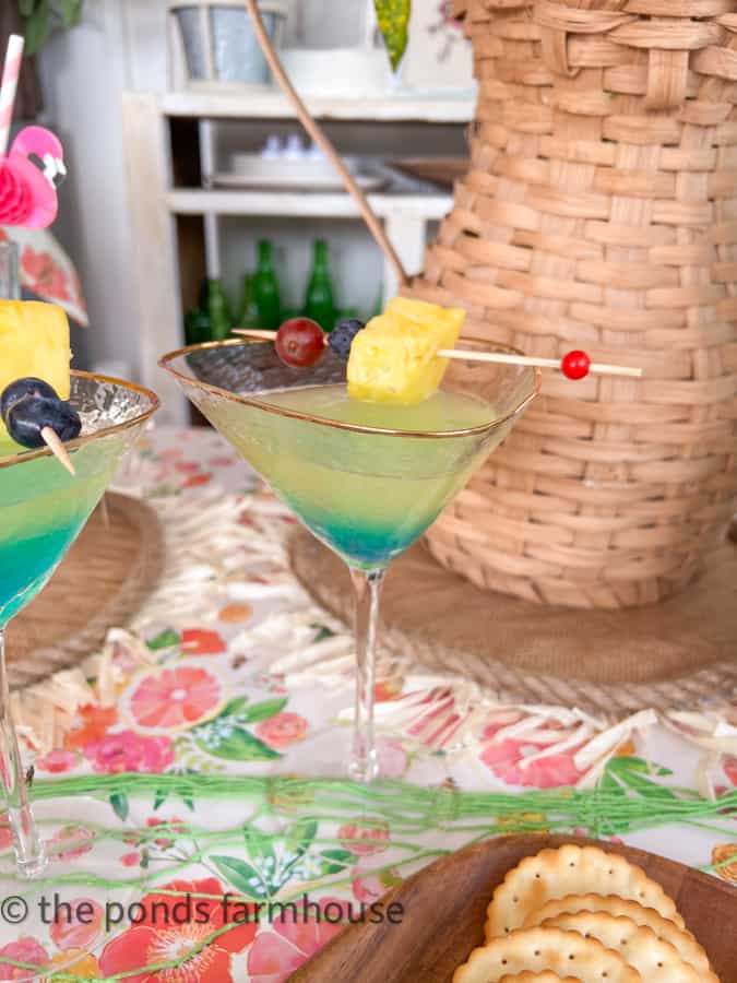 Pina Colada Martini with fresh fruit on a skewer 