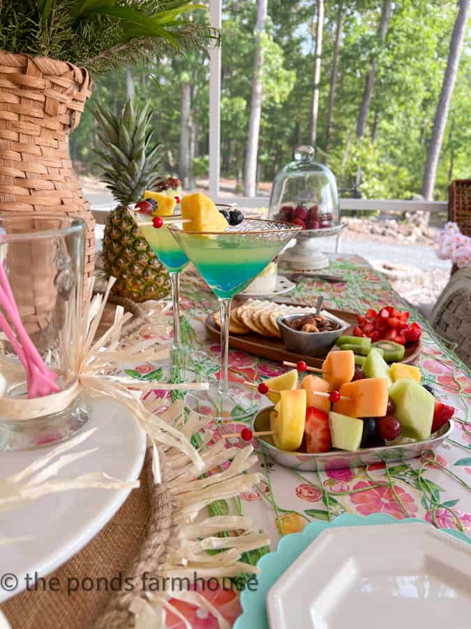 Tropical Cocktail Party set up with appetizers and fresh fruit