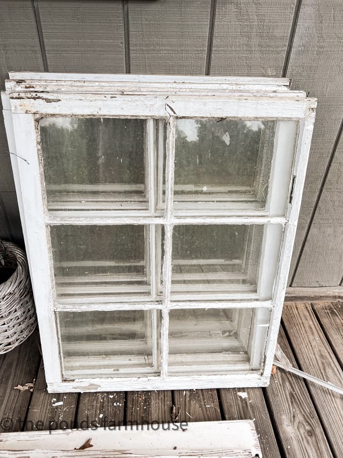 Reclaimed windows for rustic kitchen cabinets salvaged from 1940's beach cottage.  